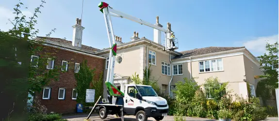 using our cherry picker on a commercial gutter cleaning job in Lincoln